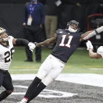 ATLANTA, GA - DECEMBER 06: The football slips through the hands of wide receiver Julio Jones 11 of the Atlanta Falcons