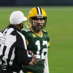 GREEN BAY, WI - JANUARY 16: Green Bay Packers quarterback Aaron Rodgers (12) gets an explanation from referee Ron Torber