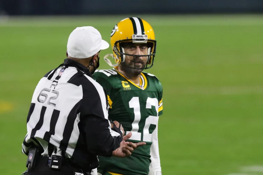 GREEN BAY, WI - JANUARY 16: Green Bay Packers quarterback Aaron Rodgers (12) gets an explanation from referee Ron Torber