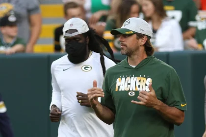 GREEN BAY, WI - AUGUST 14: Green Bay Packers quarterback Aaron Rodgers (12) comes out for the game during a game betwee