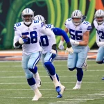 CINCINNATI, OH - DECEMBER 13: Dallas Cowboys defensive end Aldon Smith (58) grabs a fumble and scores a touchdown during