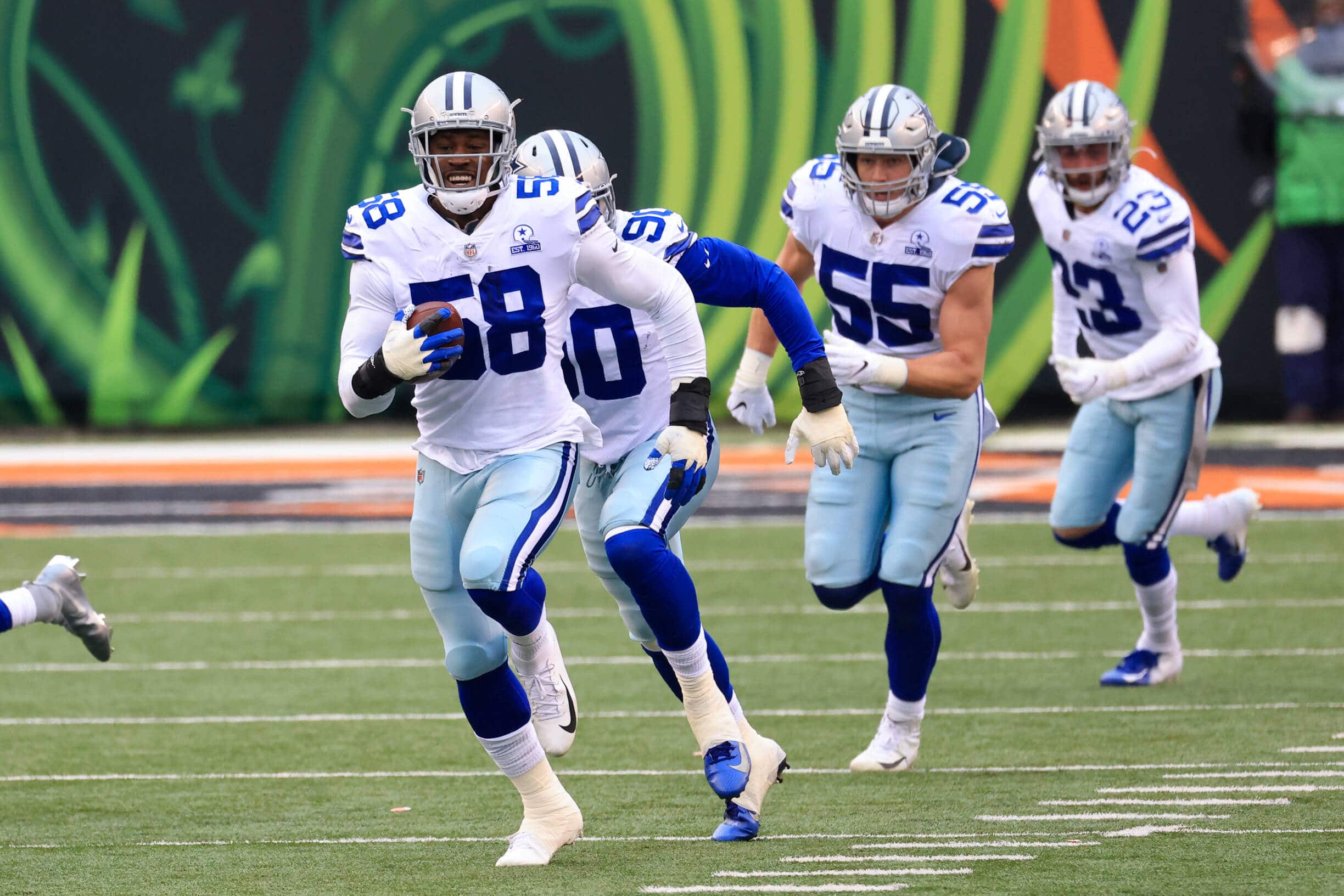 CINCINNATI, OH - DECEMBER 13: Dallas Cowboys defensive end Aldon Smith (58) grabs a fumble and scores a touchdown during