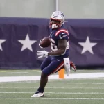 FOXBOROUGH, MA - JANUARY 03: New England Patriots running back Sony Michel (26) gets to the outside during a game betwee