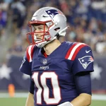 FOXBOROUGH, MA - AUGUST 12: New England Patriots quarterback Mac Jones (10) during a preseason game between the New Engl