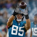JACKSONVILLE, FL - AUGUST 14: Jacksonville Jaguars Tight End Tim Tebow (85) catches the ball on the sidelines during th