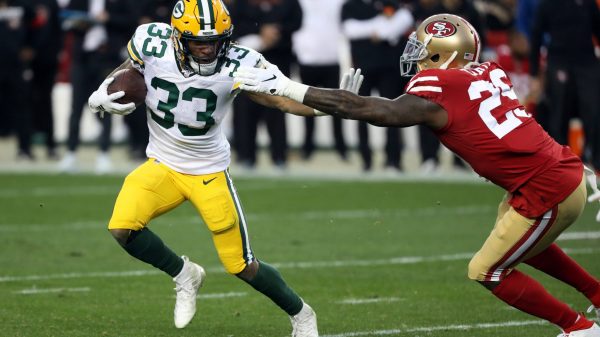 SANTA CLARA, CA - JANUARY 19: Green Bay Packers Running Back Aaron Jones rushes with the ball during an NFC Conference C