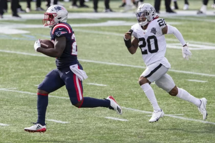 running back Sony Michel (26) runs up field while chased by Las Vegas Raiders cornerback Damon Arnette