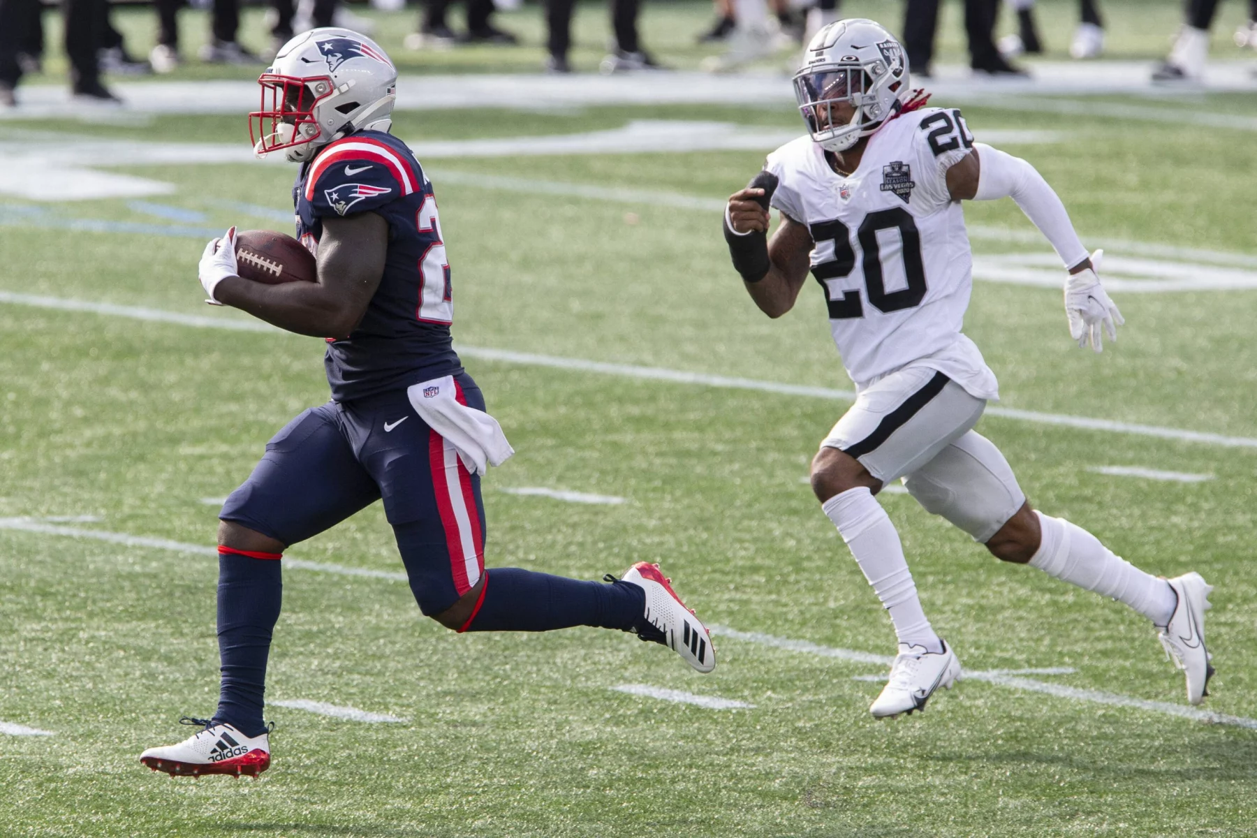 running back Sony Michel (26) runs up field while chased by Las Vegas Raiders cornerback Damon Arnette