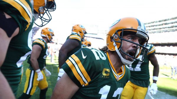 October 17, 2021: Green Bay Packers quarterback Aaron Rodgers celebrates with his teammates after rushing for a touchdow