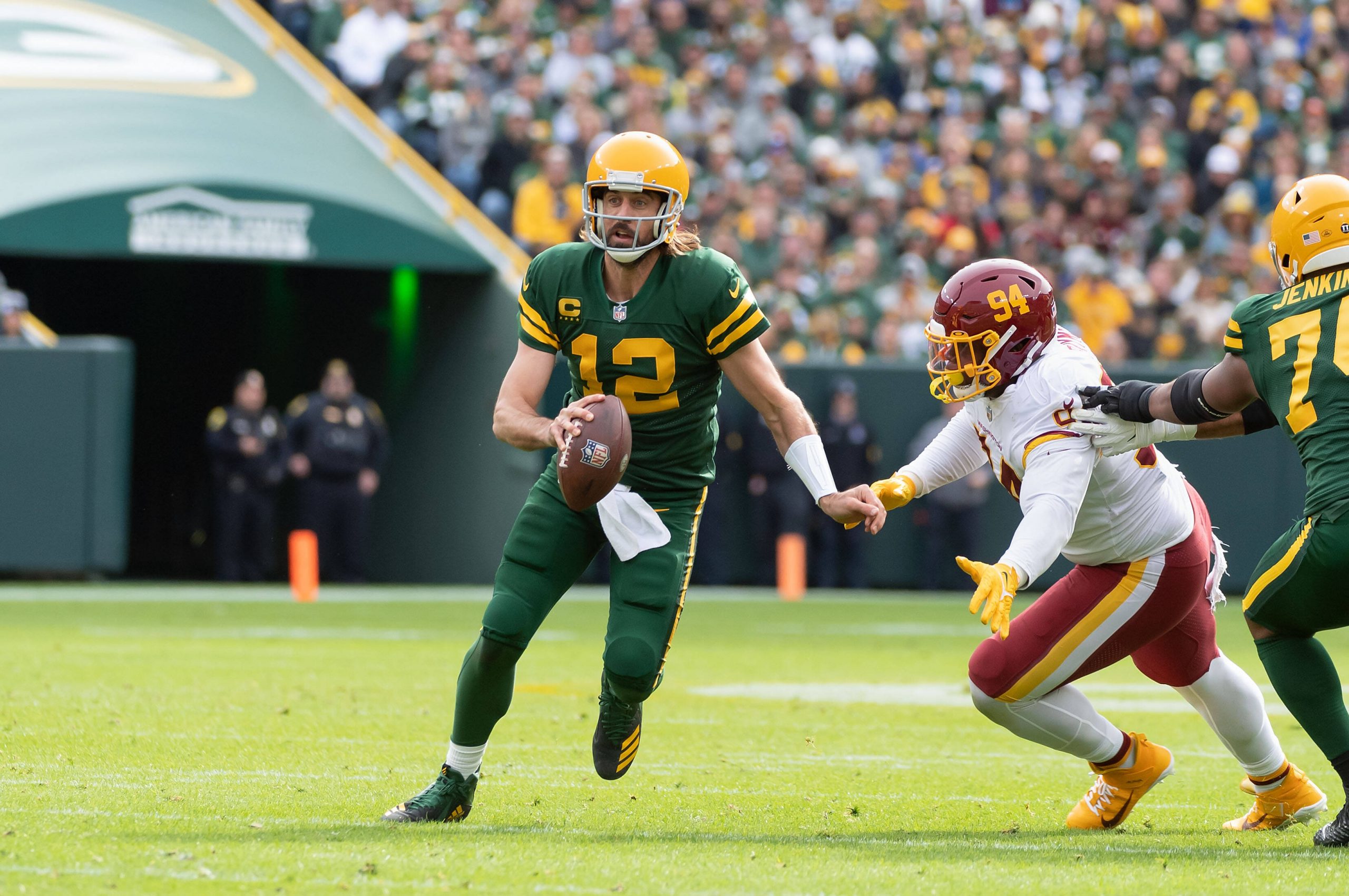 October 24, 2021: Green Bay Packers quarterback Aaron Rodgers 12 avoids a sack by Washington Football Team defensive tac