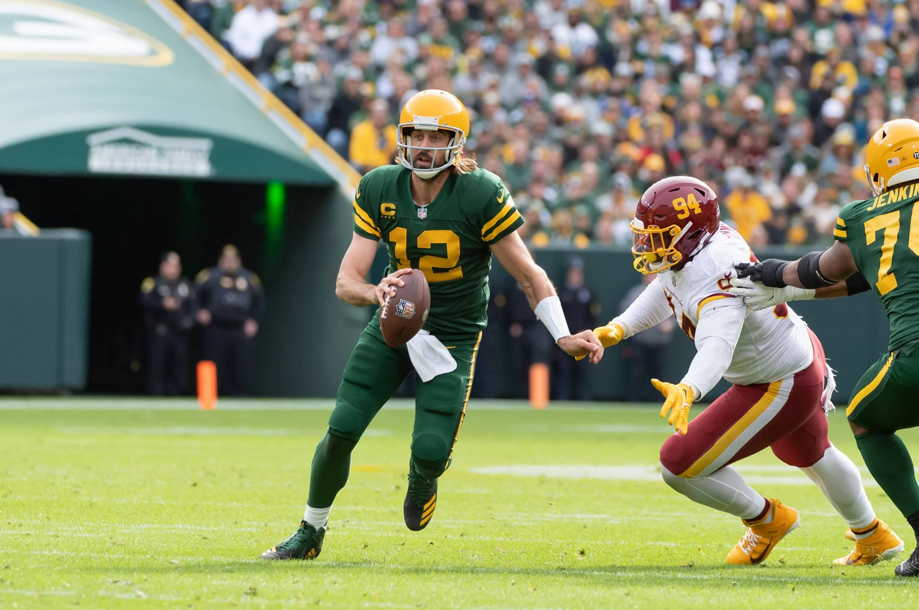 October 24, 2021: Green Bay Packers quarterback Aaron Rodgers 12 avoids a sack by Washington Football Team defensive tac