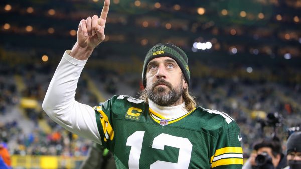 November 28, 2021: Green Bay Packers quarterback Aaron Rodgers (12) signals number 1 as he walks off the field after th