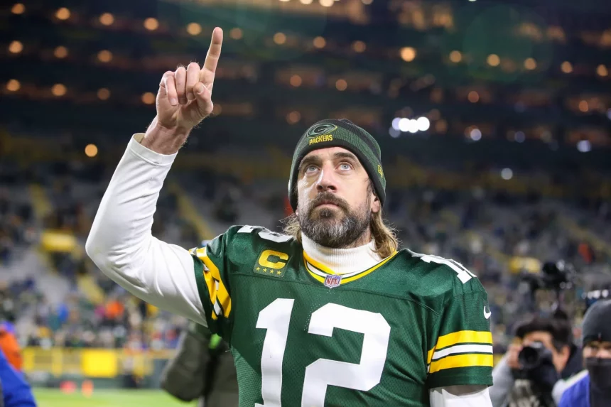November 28, 2021: Green Bay Packers quarterback Aaron Rodgers (12) signals number 1 as he walks off the field after th