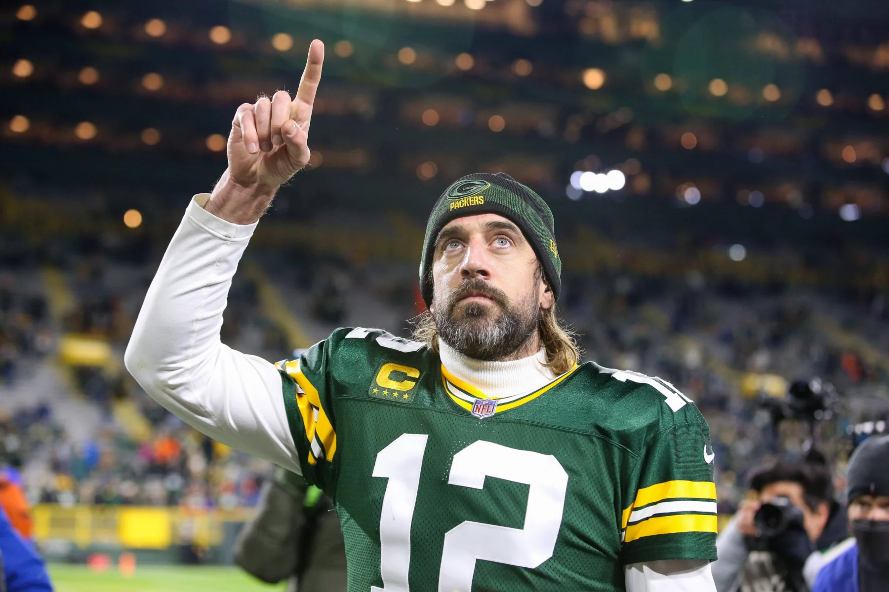 November 28, 2021: Green Bay Packers quarterback Aaron Rodgers (12) signals number 1 as he walks off the field after th
