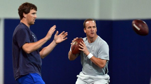 April 11, 2013 - Durham, NC, USA - Peyton Manning and his brother Eli run through drills during a wo