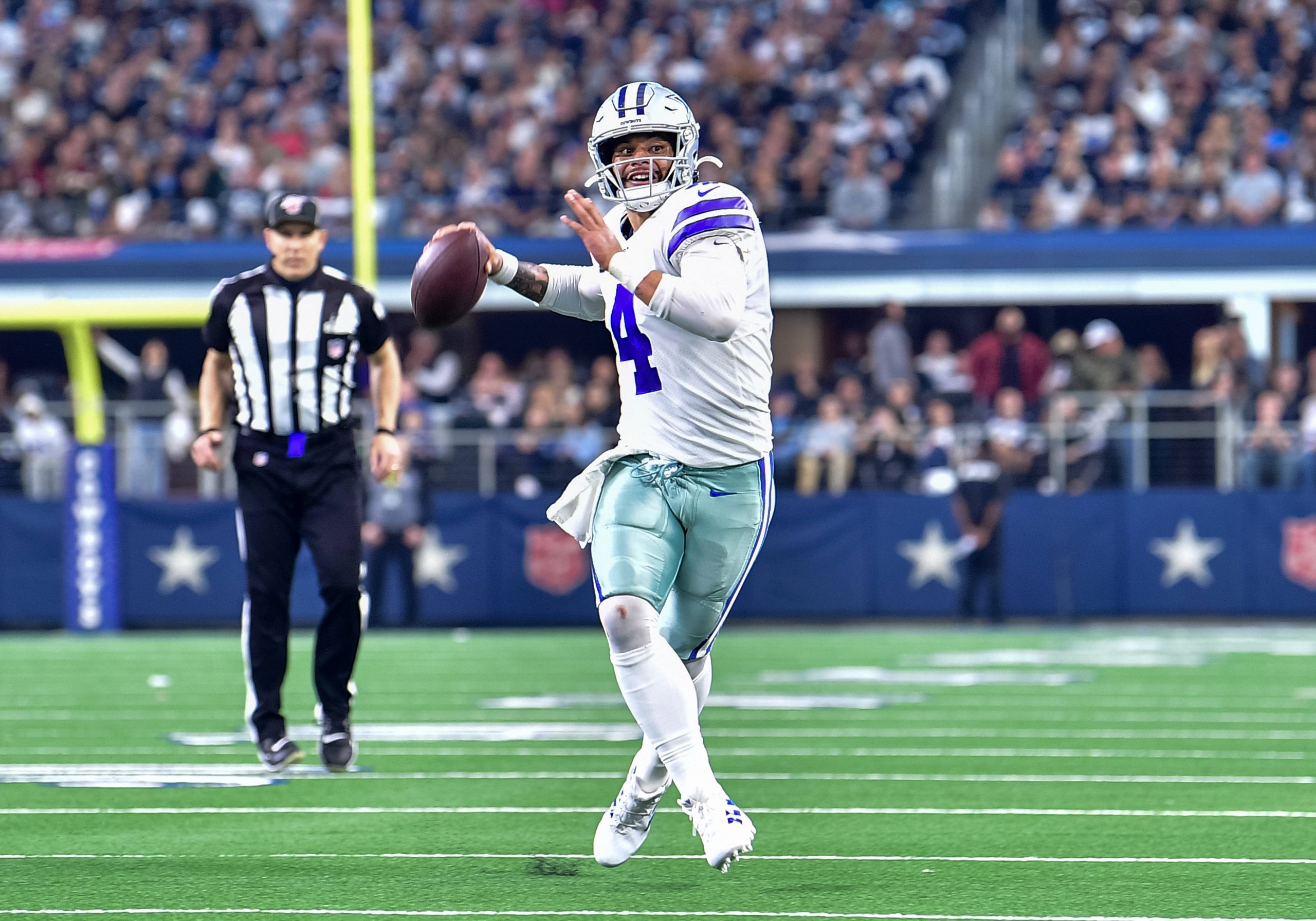 December 29th, 2019:.Dallas Cowboys quarterback Dak Prescott (4) scrambles outside to avoid pressure