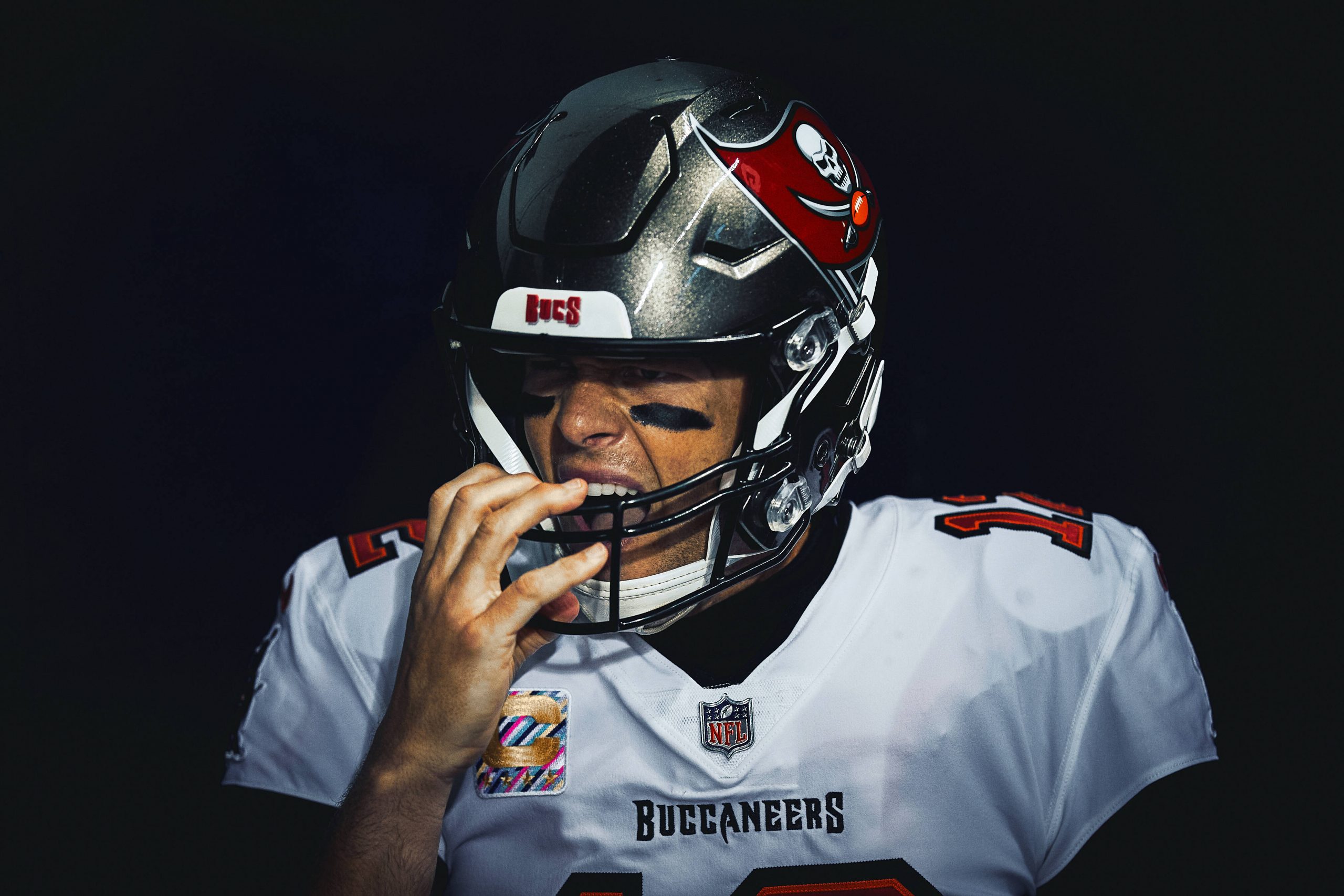 CHICAGO, IL - OCTOBER 08: Tampa Bay Buccaneers Quarterback Tom Brady (12) adjusts his helmet prior to game action for a