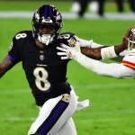 Baltimore Ravens quarterback Lamar Jackson (8) pushes Kansas City Chiefs safety Juan Thornhill (22) away during the firs