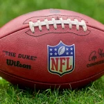 CHICAGO, IL - AUGUST 21: A detail view of the NFL, American Football Herren, USA crest logo is seen on a Wilson football