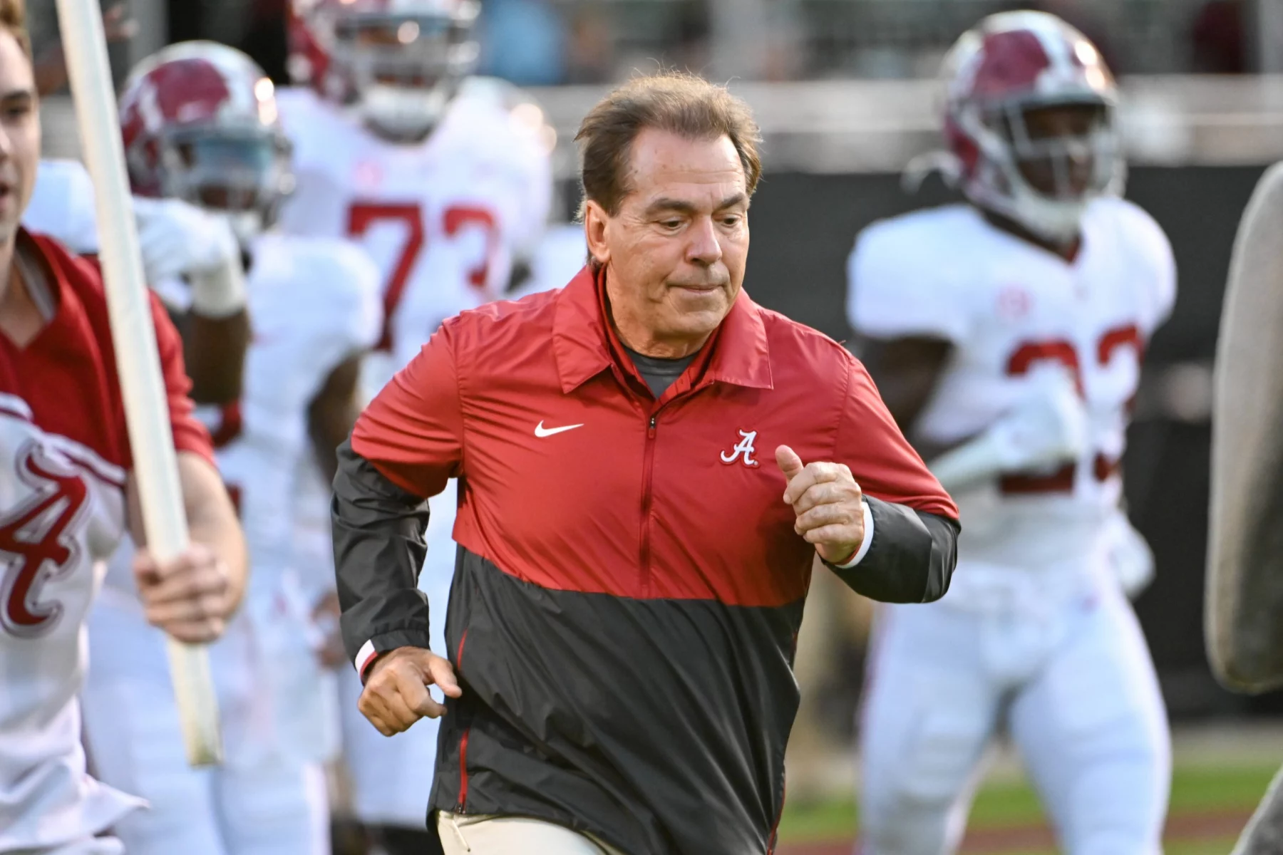 October 16, 2021: Alabama Crimson Tide head coach Nick Saban leads his team onto the field before the NCAA, College Leag