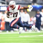 INGLEWOOD, CA - OCTOBER 31: New England Patriots Running Back Damien Harris (37) breaks free from a tackle during the NF