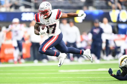 INGLEWOOD, CA - OCTOBER 31: New England Patriots Running Back Damien Harris (37) breaks free from a tackle during the NF