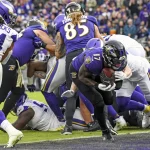 BALTIMORE, MD - NOVEMBER 07: Baltimore Ravens running back Le Veon Bell (17) scores on a rushing touchdown in the fourth