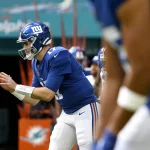 MIAMI GARDENS, FL - DECEMBER 05: New York Giants Quarterback Jake Fromm (17) warms up before the NFL, American Football