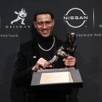 Sport Bilder des Tages Quarterback Bryce Young from Alabama arrives for photos after he wins the Heisman Trophy at the M