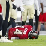 December 19, 2021, Tampa, Florida, USA: Tampa Bay Buccaneers wide receiver Chris Godwin (14) is seen on the ground after