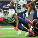 HOUSTON, TX - DECEMBER 29: Tennessee Titans running back Derrick Henry (22) dives for additional yardage as Houston Texa