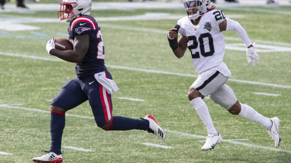 New England Patriots running back Sony Michel (26) runs up field while chased by Las Vegas Raiders cornerback Damon Arne