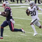 New England Patriots running back Sony Michel (26) runs up field while chased by Las Vegas Raiders cornerback Damon Arne