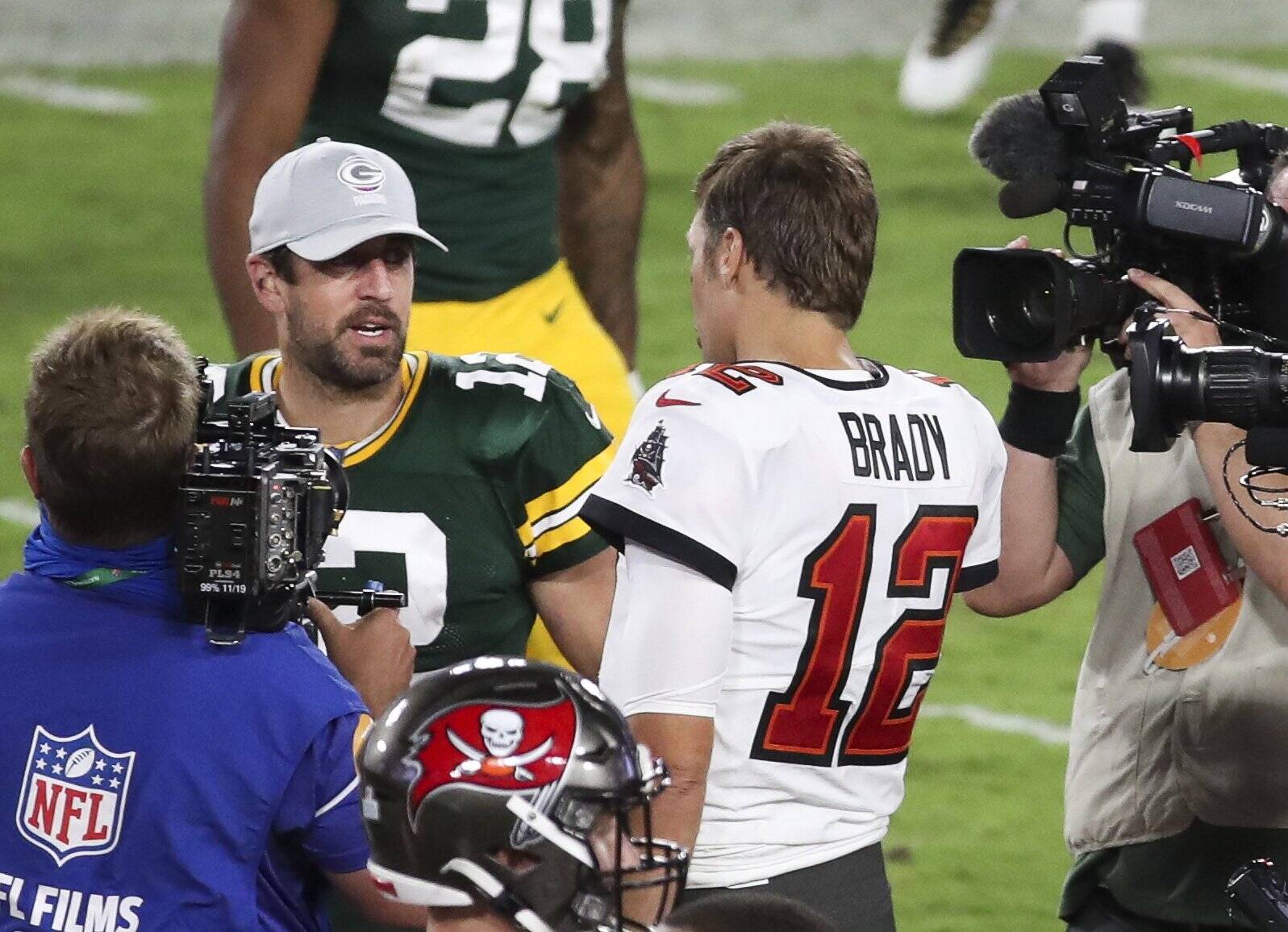 October 18, 2020, Tampa, Florida, USA: Green Bay Packers quarterback Aaron Rodgers (12), left, talks with Tampa Bay Buc