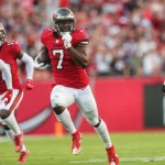 TAMPA, FL - DECEMBER 12: Tampa Bay Buccaneers Running Back Leonard Fournette (7) carries the ball for a touchdown during
