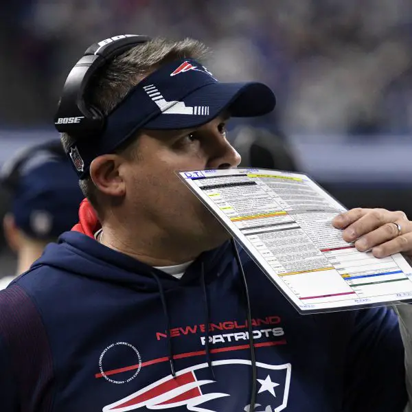 INDIANAPOLIS, IN - DECEMBER 18: New England Patriots offensive coordinator Josh McDaniels covers his mouth as he talks o