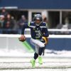 December 26, 2021: Seattle Seahawks quarterback Russell Wilson (3) scrambles out of the pocket in the snow during a game