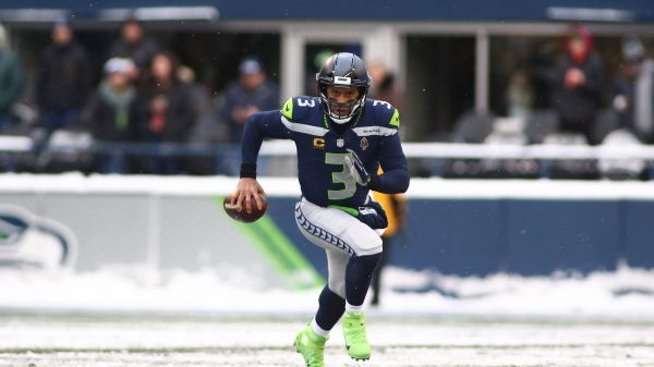 December 26, 2021: Seattle Seahawks quarterback Russell Wilson (3) scrambles out of the pocket in the snow during a game