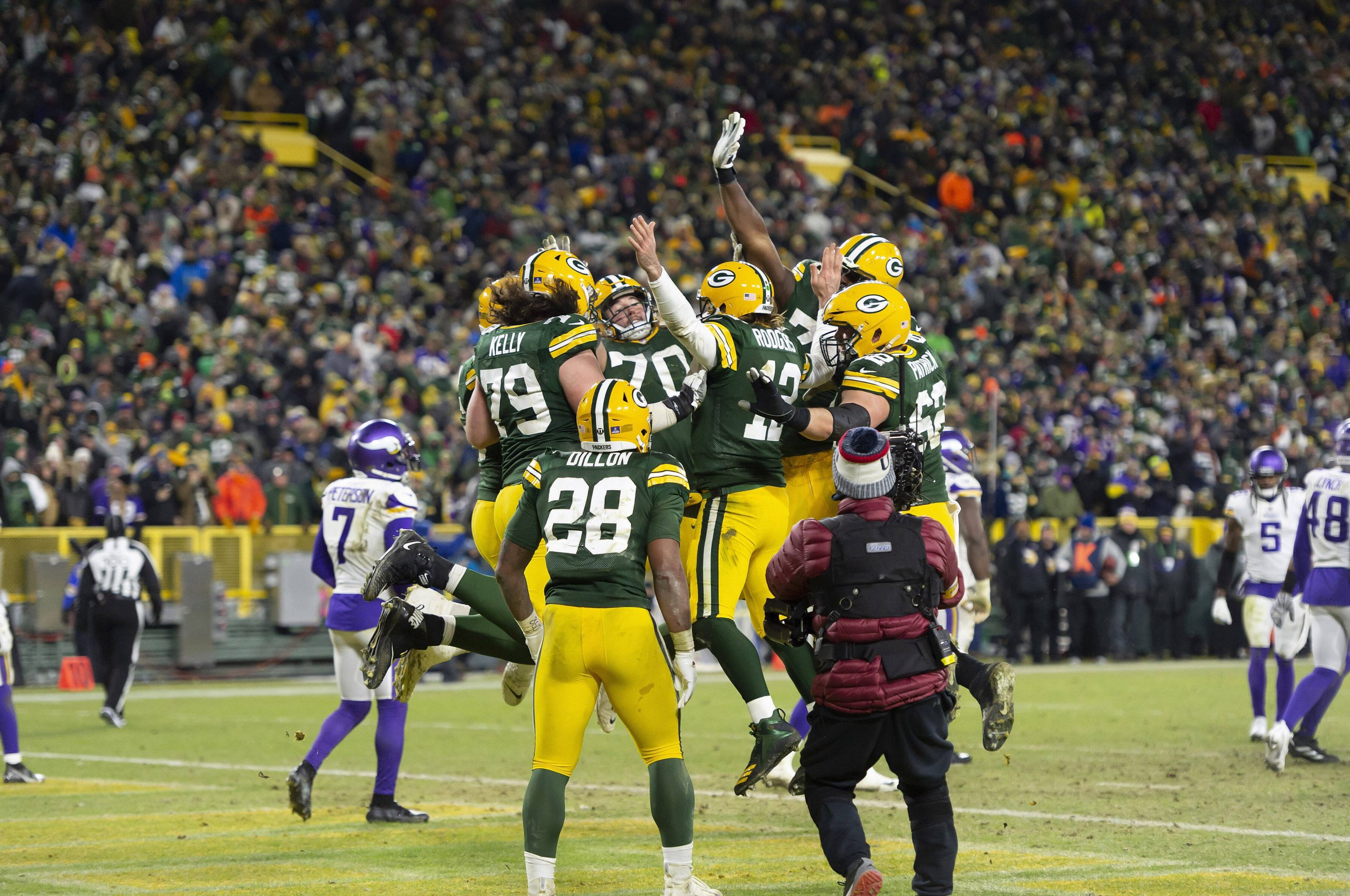 Green Bay Packers running back A.J. Dillon 28 and Packers quarterback Aaron Rodgers