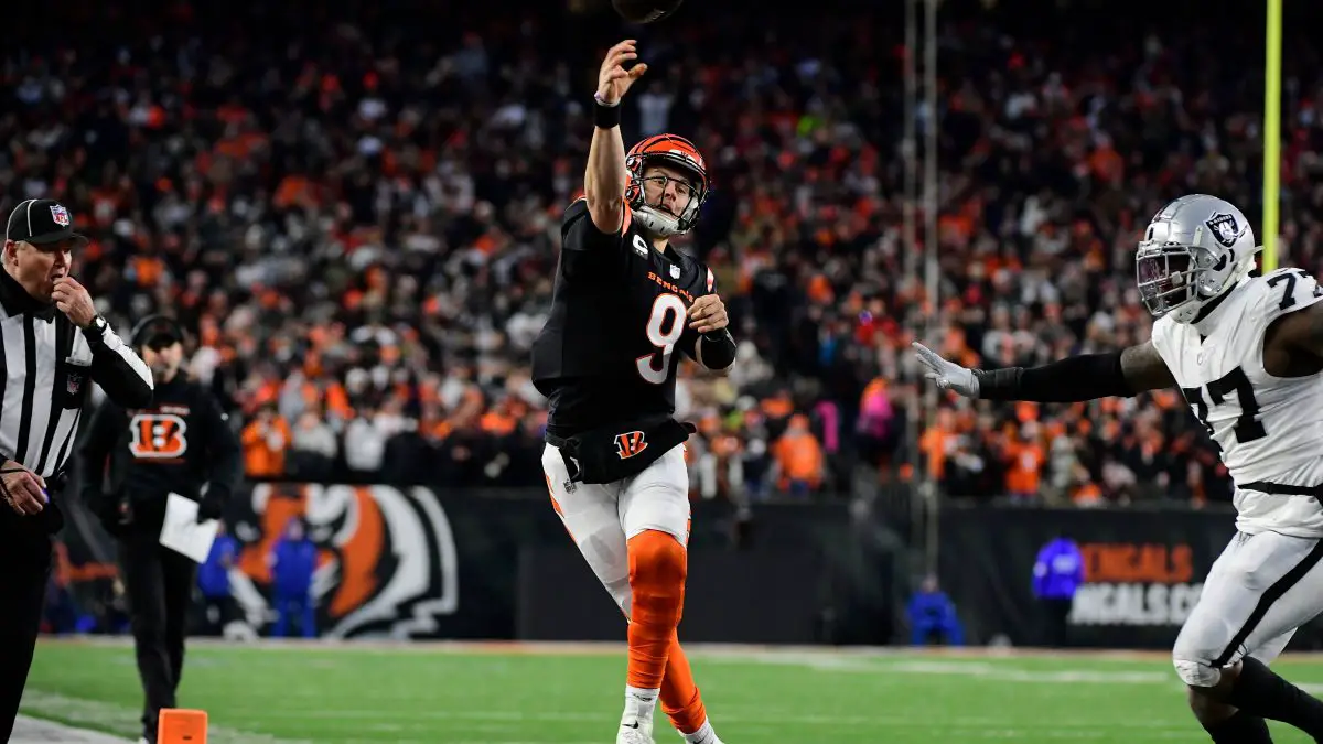 Saturday January 15, 2022: Cincinnati Bengals quarterback Joe Burrow (9) stays in bounds and throws a touchdown during t