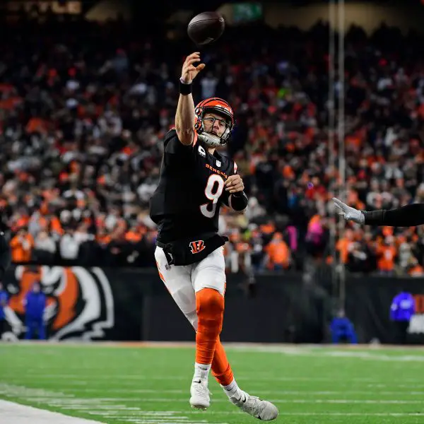 Saturday January 15, 2022: Cincinnati Bengals quarterback Joe Burrow (9) stays in bounds and throws a touchdown during t