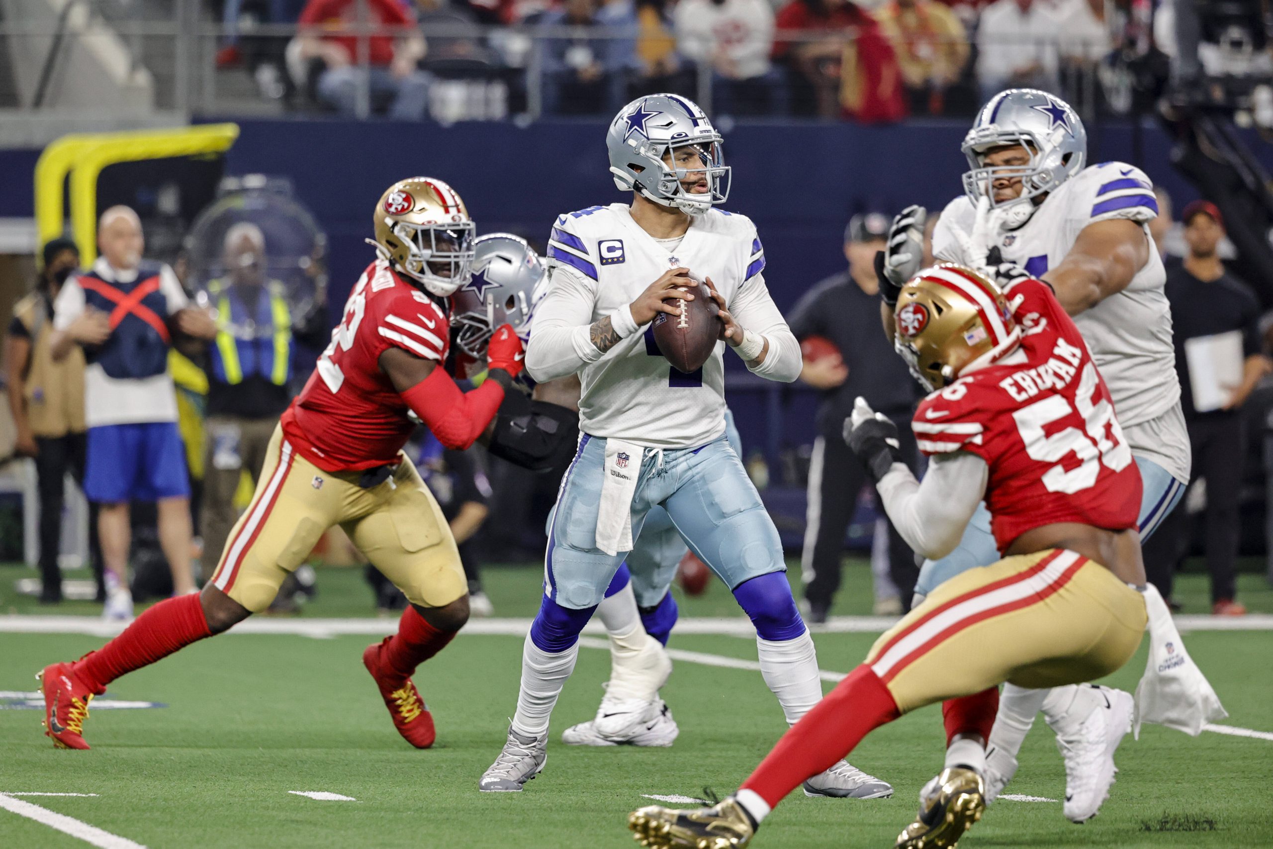 ARLINGTON, TX - JANUARY 16: Dallas Cowboys quarterback Dak Prescott (4) looks downfield for an open receiver during the