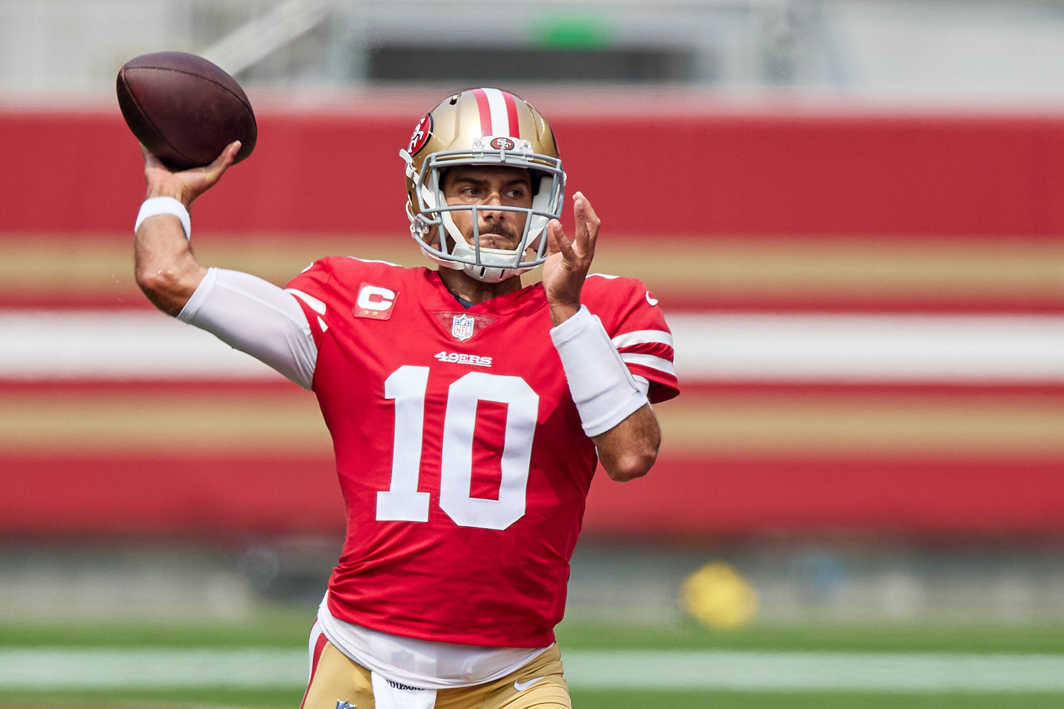 SAN FRANCISCO, CA - SEPTEMBER 13: San Francisco 49ers quarterback Jimmy Garoppolo (10) looks to throw the football runs