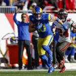 TAMPA, FL - JANUARY 23: Los Angeles Rams wide receiver Cooper Kupp (10) catches a pass and runs for a touchdown during t