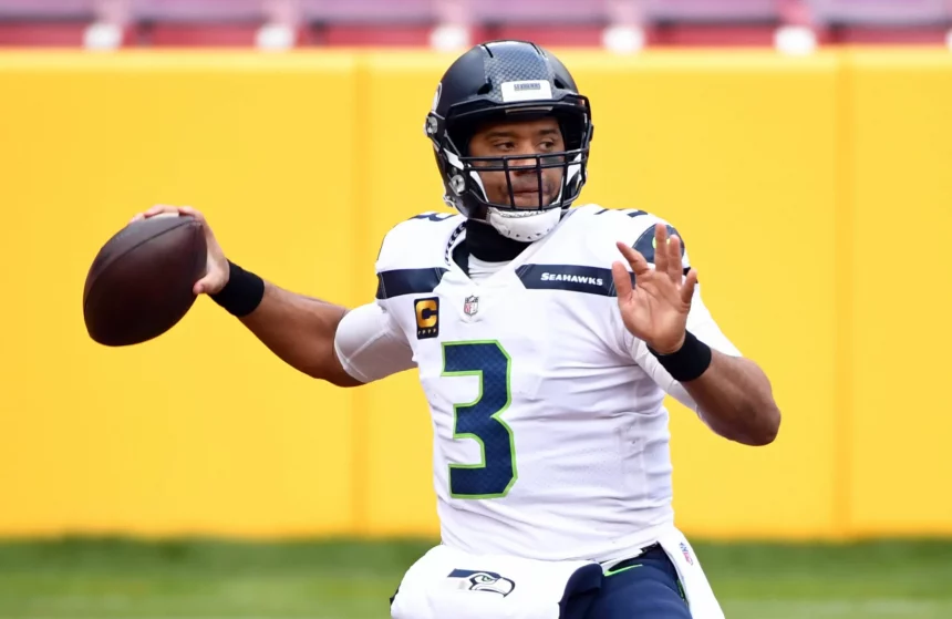 Seattle Seahawks quarterback Russell Wilson (3) looks to pass againt the Washington Football Team at FedEx Field in Lan