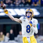 December 4, 2021: Pittsburgh Panthers quarterback Kenny Pickett 8 throws on the run during the third quarter against the Wake Forest Demon Deacons in the ACC Championship at Bank of America Stadium in Charlotte, NC. /Cal Media Charlotte United States - ZUMAc04_ 20211204_zaf_c04_335 Copyright: xScottxKinserx