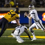September 04 2021 Berkeley, CA USA Nevada quarterback Carson Strong 12 runs out of the pocket to avoid California linebacker Evan Tattersall 54 during the NCAA, College League, USA Football game between Nevada Wolf Pack and the California Golden Bears. Nevada won 22-17 from FTX Field at California Memorial Stadium. /CSM Berkeley USA - ZUMAc04_ 20210904_zaf_c04_1437 Copyright: xThurmanxJamesx