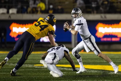 September 04 2021 Berkeley, CA USA Nevada quarterback Carson Strong 12 runs out of the pocket to avoid California linebacker Evan Tattersall 54 during the NCAA, College League, USA Football game between Nevada Wolf Pack and the California Golden Bears. Nevada won 22-17 from FTX Field at California Memorial Stadium. /CSM Berkeley USA - ZUMAc04_ 20210904_zaf_c04_1437 Copyright: xThurmanxJamesx