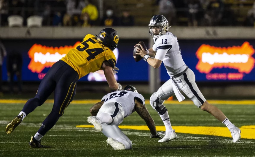 September 04 2021 Berkeley, CA USA Nevada quarterback Carson Strong 12 runs out of the pocket to avoid California linebacker Evan Tattersall 54 during the NCAA, College League, USA Football game between Nevada Wolf Pack and the California Golden Bears. Nevada won 22-17 from FTX Field at California Memorial Stadium. /CSM Berkeley USA - ZUMAc04_ 20210904_zaf_c04_1437 Copyright: xThurmanxJamesx