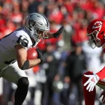 KANSAS CITY, MO - DECEMBER 12: Las Vegas Raiders wide receiver Hunter Renfrow 13 tries to stiff arm Kansas City Chiefs wide receiver Marcus Kemp 85 during a punt return in the first quarter of an NFL, American Football Herren, USA game between the Las Vegas Raiders and Kansas City Chiefs on Dec 12, 2021 at GEHA Field at Arrowhead Stadium in Kansas City, MO. Photo by Scott Winters/Icon Sportswire NFL: DEC 12 Raiders at Chiefs Icon2112120174